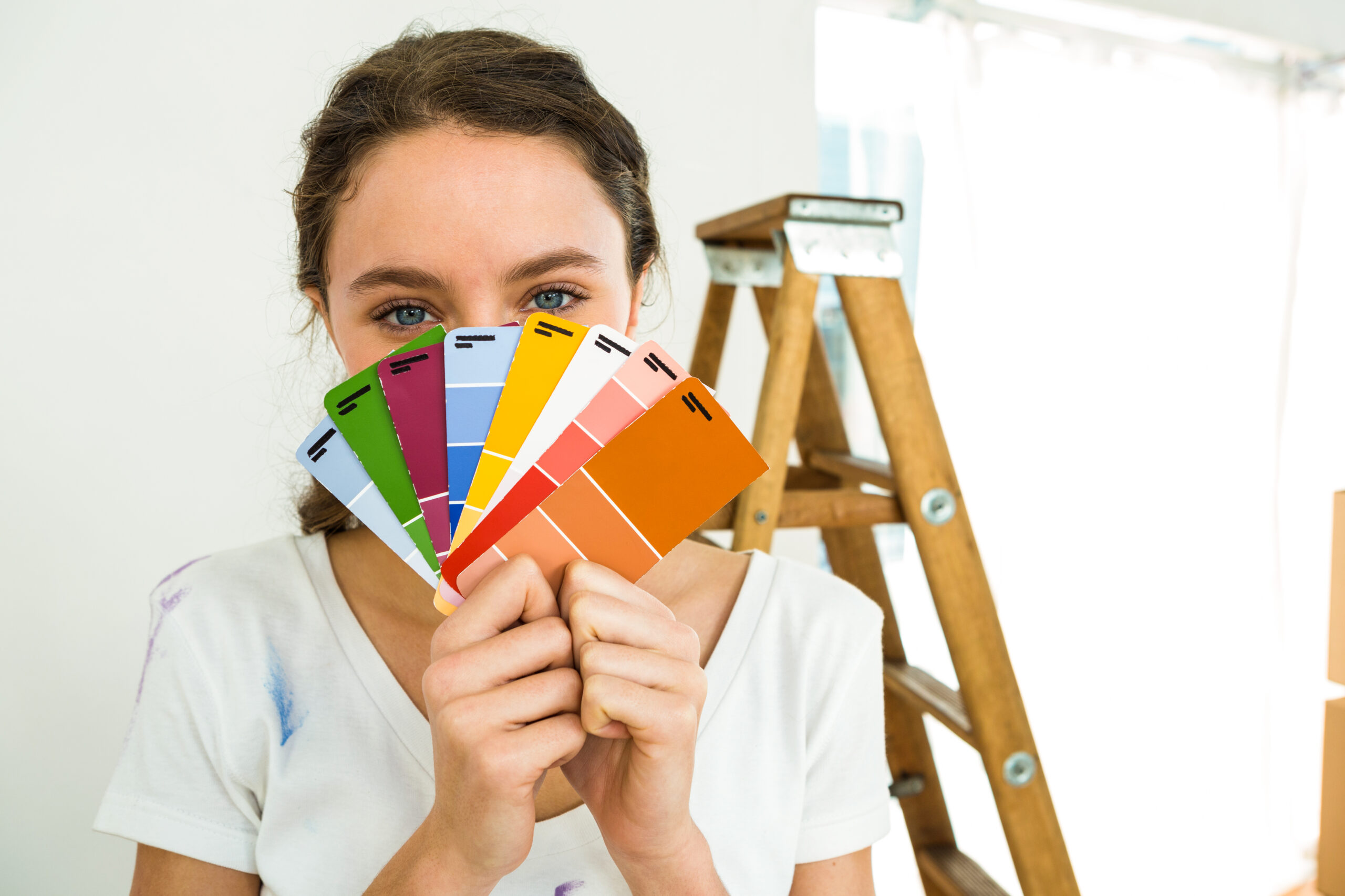 girl showing color samples to the camera